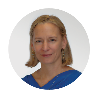 Smiling headshot of Suzanne McDonald, President of Nakupuna Consulting, LLC at Nakupuna Companies, with shoulder length blond hair and a blue blouse.