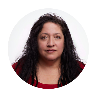 Headshot of Ret Grady, Chief Human Resources Officer at Nakupuna Companies, with long, dark brown hair, wearing a burgundy top. She has a calm and serious expression.