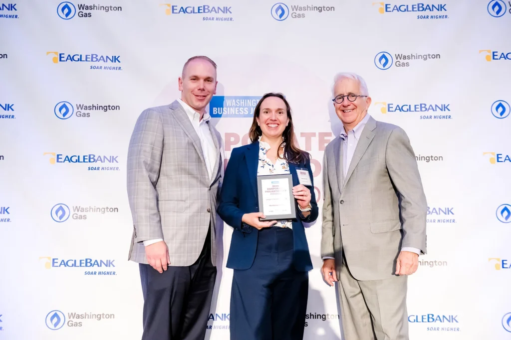 Jason Greenawalt and Kaitlin Ekechuku accepting the Washington Business Journal Corporate Philanthropy Award on behalf of Nakupuna